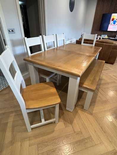 Large extendable 8 seater table with 5 chairs and a bench