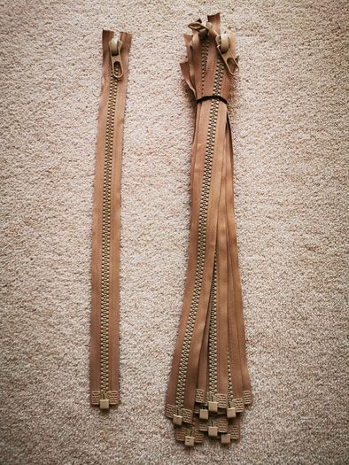 Zip, beige, separates /splits to be sewn into the jacket