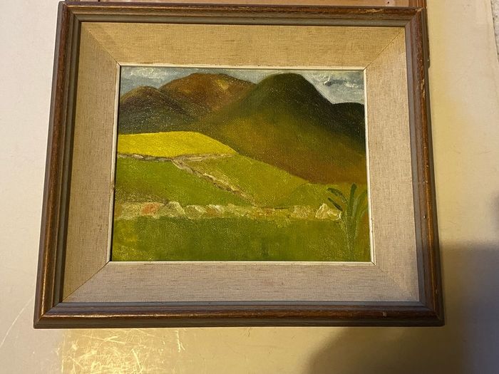An original regional landscape painting depicting a mountainous Irish rural scene with traditional dry-stone walls, rolling green pastures, and a patch of bright yellow crop or gorse under an overcast sky