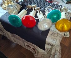 Large Theatrical or Display Lighting, including reflector lamps and colored PAR-style bulbs, with various lamp holders, plugs, and coiled electrical leads all working