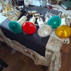 Large Theatrical or Display Lighting, including reflector lamps and colored PAR-style bulbs, with various lamp holders, plugs, and coiled electrical leads all working