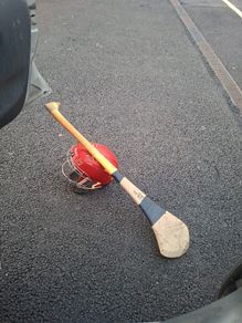 hurling helmet and hurl