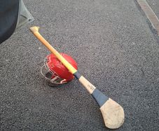 hurling helmet and hurl