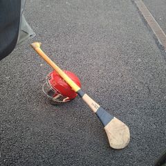 hurling helmet and hurl