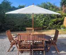 Teak Garden extending table and 6 reclining armchairs