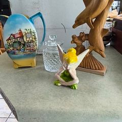 Is 4 items 1-  vintage Lancaster Sandland English Ware ceramic pitcher featuring a transferware scene of a tavern or inn. in good overall condition 20.00 euro, Tipperary crystal jam / honey pot 23.00 euro, Marine Dolphin Statue, Solid Wood Carved 35.00 eu