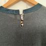 NAF NAF fine knit jumper dress in a rich dark green shade. Image 4
