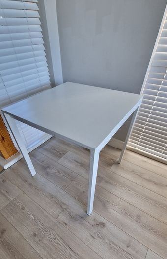 IKEA table, 75x75x74 with 2 chairs. Seat covers included for FREE!