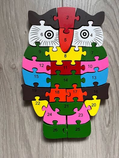 wooden jigsaw puzzle with numbers and letters