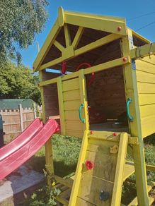 Playhouse with look out tower, swings, slide, picnic table