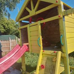 Playhouse with look out tower, swings, slide, picnic table