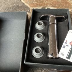 Le creuset metal wine pump and stoppers boxed