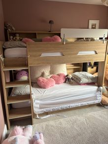 Kids bunk bed with shelving