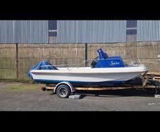 Boat and 3 engines  plus old trailer