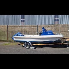 Boat and 3 engines  plus old trailer