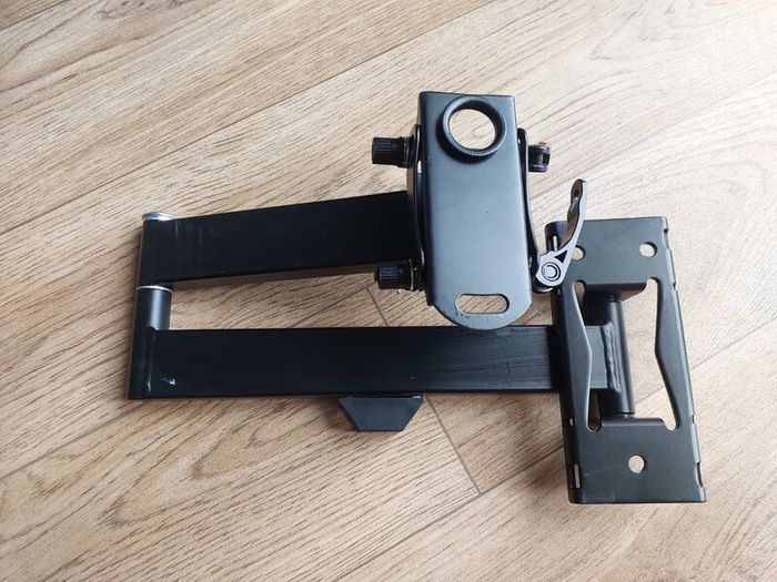 Heavy-duty adjustable monitor/display mounting arm in very good condition.