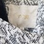 Maje black and white Gadget coat. Mid-weight cotton-jacquard. Front slit pockets, goat trim, fully lined. Asymmetric button fastenings through front. 79% cotton Image 4