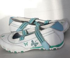 New white shoes with butterfly design