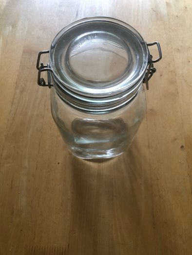 Airtight glass storage jar with clasp