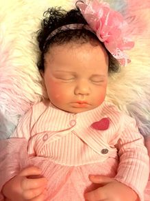 doll.         Full bodied silicone baby doll