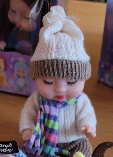Mini baby dolls in sweet outfits