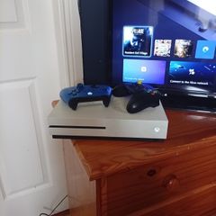 Xbox one s 500 GB with TV and 2 controllers