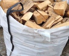 Ton bags of dry hard wood.