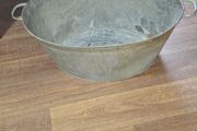 A Beautiful Large Old Galvanized Steel Wash Tub with Side Handles in nice used condition and is frequently used for Farmhouse Decor or Garden