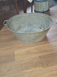 A Beautiful Large Old Galvanized Steel Wash Tub with Side Handles in nice used condition and is frequently used for Farmhouse Decor or Garden