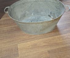 A Beautiful Large Old Galvanized Steel Wash Tub with Side Handles in nice used condition and is frequently used for Farmhouse Decor or Garden
