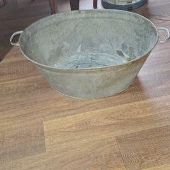A Beautiful Large Old Galvanized Steel Wash Tub with Side Handles in nice used condition and is frequently used for Farmhouse Decor or Garden