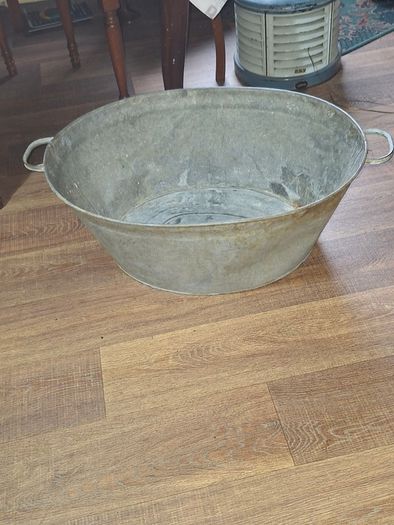A Beautiful Large Old Galvanized Steel Wash Tub with Side Handles in nice used condition and is frequently used for Farmhouse Decor or Garden
