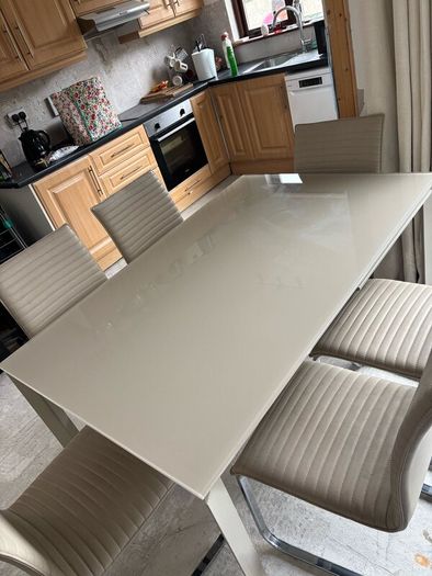 Extending dining table and chairs for sale