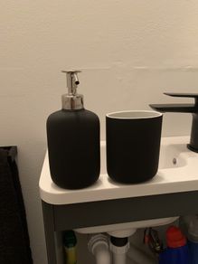 Soap dispenser and toothbrush holder