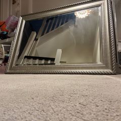 Rectangular ornate mirror with chrome trim