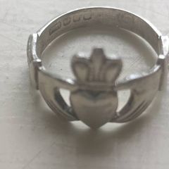 Claddagh ring and   1 Other. Both Sterling Silver.