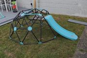 Climbing frame with slide