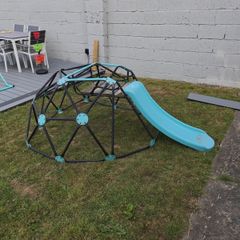 Climbing frame with slide