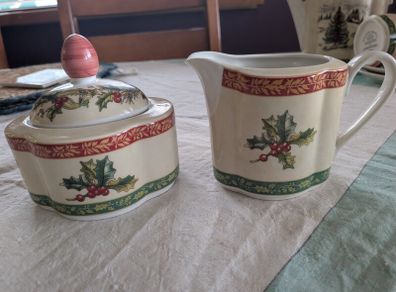 Vintage Villeroy and Boch sugar bowl and milk jug in Festive Memories pattern.
