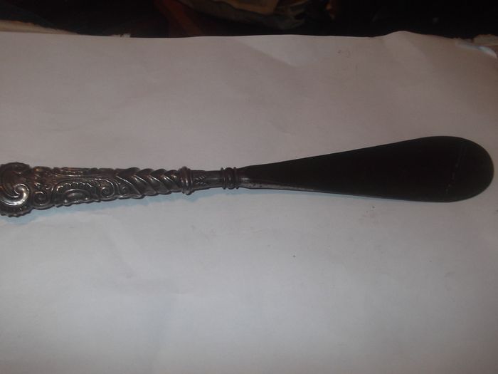 a antique silver handle and steel shue horn