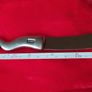 A collectible knife made of polished pewter with a stainless steel blade from Carrol Boyes. Image 4