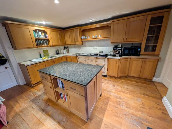 Solid wood kitchen with granite island