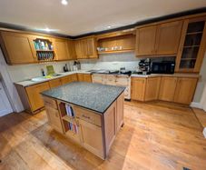 Solid wood kitchen with granite island