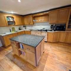 Solid wood kitchen with granite island