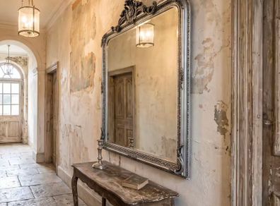 Large slightly distressed silver leaf mirror
