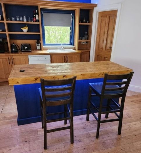 Rustic kitchen island with double overhang