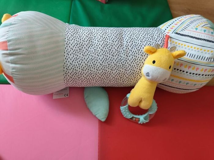 Long baby support roll pillow for tummy time & side sleeping.