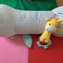 Long baby support roll pillow for tummy time & side sleeping.