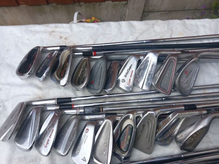 A selection of golf clubs and bags. Golf balls