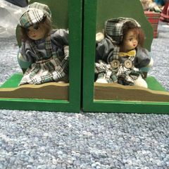 Book ends with porcelain doll
